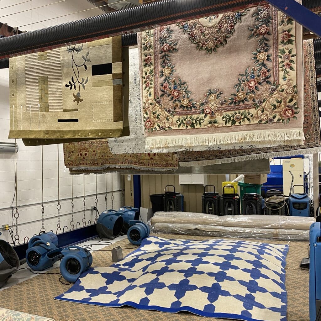 rug drying on a rack at Aero Carpet Services